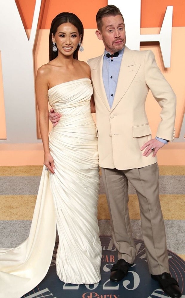 Macaulay Culkin and his wife Brenda Song attend the red carpet event